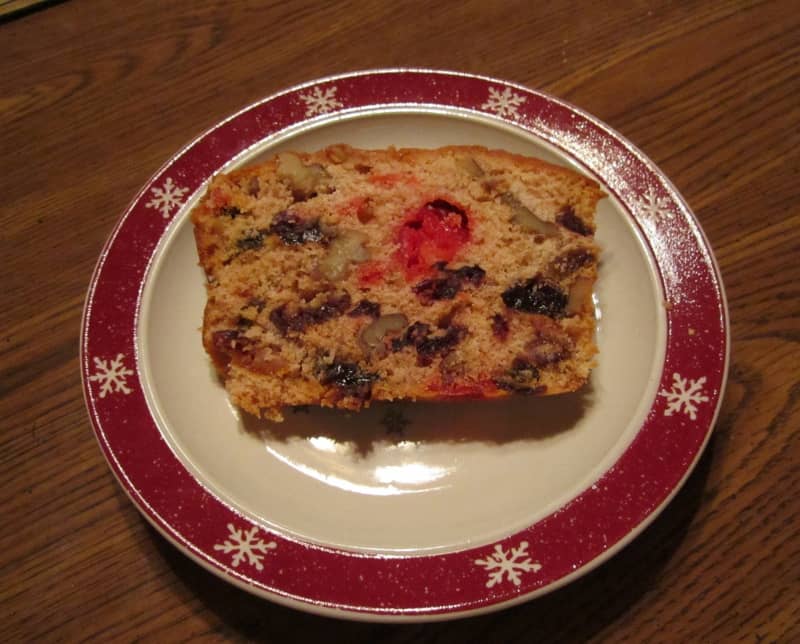 a slice of golden fruitcake, on a plate