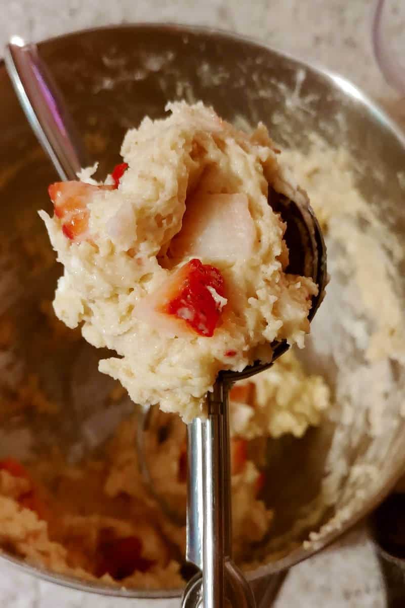 dough for strawberry and cream scones, on a cookie scoop
