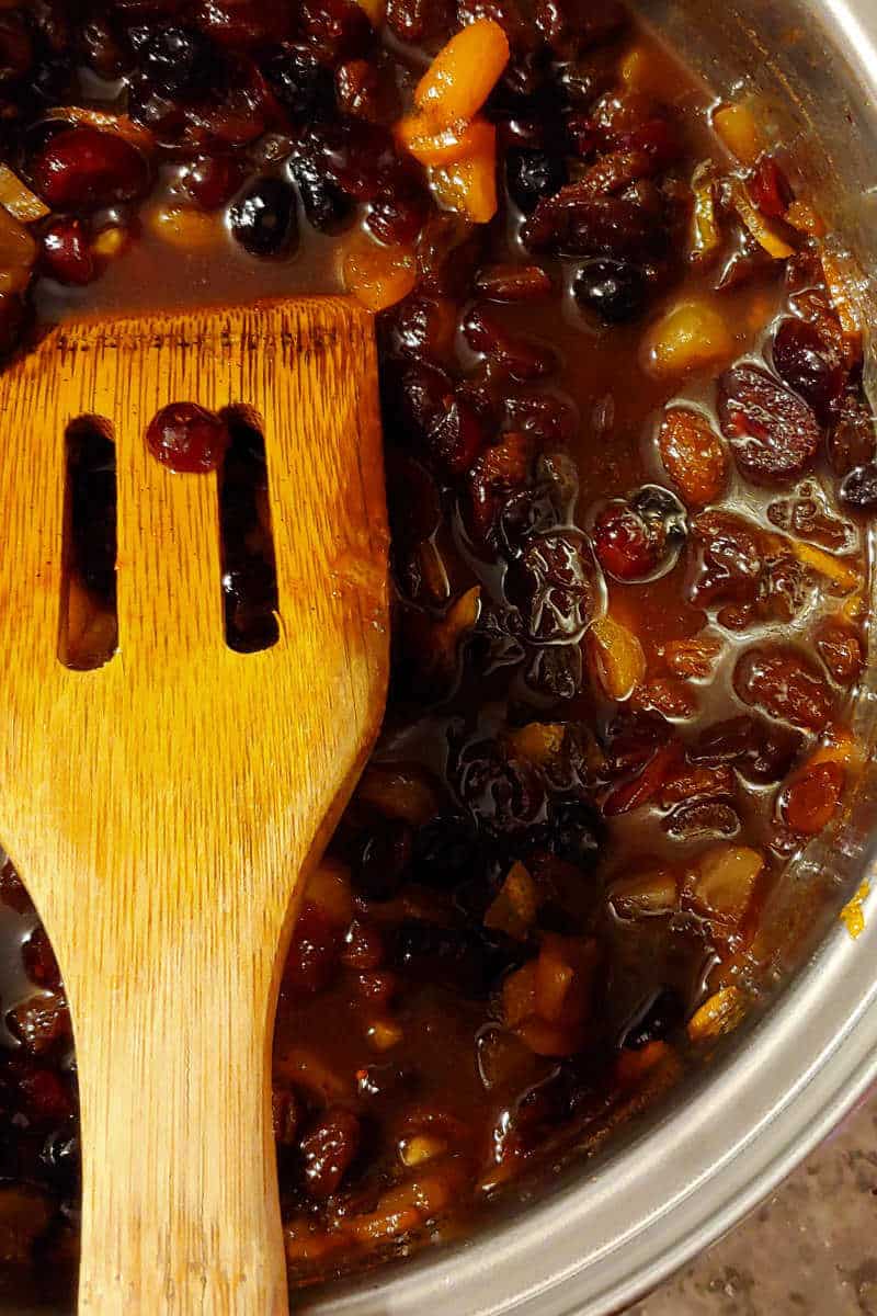 fruit for Alton Brown's fruitcake, combined with sugar and butter, in a saucepan