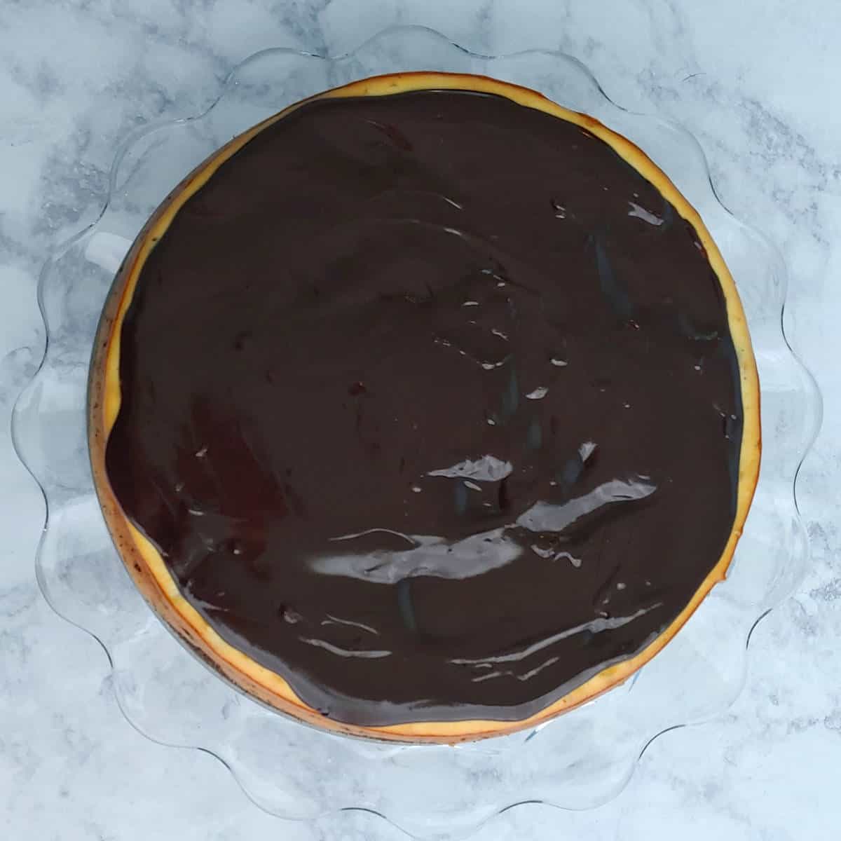 cheesecake topped with chocolate ganache